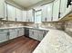 Modern kitchen with gray cabinets and granite countertops at 223 Fort Florida Rd, Debary, FL 32713