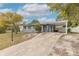 Front view of a newly renovated light gray house at 2472 Duval Ave, Deltona, FL 32738