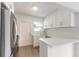 Updated kitchen featuring white shaker cabinets, quartz countertops, and stainless steel appliances at 2472 Duval Ave, Deltona, FL 32738