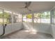 Sunroom with tile floor, ceiling fan, and view of backyard at 2472 Duval Ave, Deltona, FL 32738