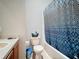 Clean bathroom with shower/tub combo and updated vanity at 2508 Balmoral Dr, Kissimmee, FL 34744