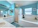 Bathroom with a shower, bathtub, and double vanity at 2508 Balmoral Dr, Kissimmee, FL 34744
