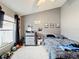 Well-lit bedroom with double bed, dresser, and window at 2508 Balmoral Dr, Kissimmee, FL 34744
