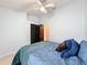 Comfortable bedroom with ceiling fan and double doors at 2508 Balmoral Dr, Kissimmee, FL 34744