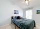 Cozy bedroom with ceiling fan and artwork at 2508 Balmoral Dr, Kissimmee, FL 34744