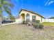 House exterior showcasing landscaping and a driveway at 2508 Balmoral Dr, Kissimmee, FL 34744