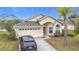 Exterior view of a single-Gathering home with a driveway at 2508 Balmoral Dr, Kissimmee, FL 34744