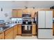 Kitchen with stainless steel appliances and granite countertops at 2508 Balmoral Dr, Kissimmee, FL 34744