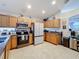 Spacious kitchen featuring granite countertops and stainless steel appliances at 2508 Balmoral Dr, Kissimmee, FL 34744
