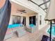 Outdoor patio with seating area adjacent to the pool at 2508 Balmoral Dr, Kissimmee, FL 34744