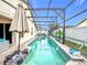 Inviting swimming pool with screened enclosure at 2508 Balmoral Dr, Kissimmee, FL 34744