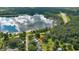 Aerial view of home, pool, and lakefront lot at 2530 E New York Ave, Deland, FL 32724