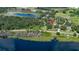 Aerial view of lakefront property with home at 2530 E New York Ave, Deland, FL 32724