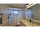 Clean bathroom with a single vanity and shower/tub combo at 2530 E New York Ave, Deland, FL 32724