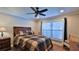 Cozy bedroom with hardwood floors and large window at 2530 E New York Ave, Deland, FL 32724