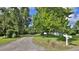 Long gravel driveway leading to a charming house at 2530 E New York Ave, Deland, FL 32724