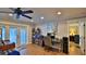 Bright home office features built-in shelving, hardwood floors, and french doors at 2530 E New York Ave, Deland, FL 32724