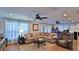 Spacious living room with a large sectional sofa and hardwood floors at 2530 E New York Ave, Deland, FL 32724