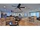 Open living space with hardwood floors, sectional sofa and dining area at 2530 E New York Ave, Deland, FL 32724