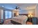 Spacious main bedroom with hardwood floors and ceiling fan at 2530 E New York Ave, Deland, FL 32724