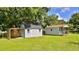 Two storage buildings, one barn style and one with a porch at 2530 E New York Ave, Deland, FL 32724