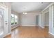 Bright dining room with hardwood floors and access to the front entrance at 2550 Groveland Ave, Deltona, FL 32725