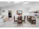 Dining area with a glass-top table and wicker chairs at 2567 Academy Ave, Deltona, FL 32738