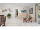 Living room with tiled floors, a sofa and a glass-top coffee table at 2567 Academy Ave, Deltona, FL 32738