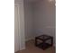 Small bedroom with a side table and closet at 2770 Coastal Bay Dr # 3-103, Orange City, FL 32763