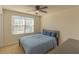 Cozy bedroom with window and ceiling fan at 3033 Meleto Blvd, New Smyrna Beach, FL 32168