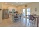 Open kitchen features stainless steel appliances and breakfast bar at 3033 Meleto Blvd, New Smyrna Beach, FL 32168