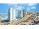 Aerial view of beachfront high-rise condos and coastal road at 3047 S Atlantic Ave # 1906, Daytona Beach, FL 32118