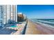 Aerial view of condo building, pool, and beach at 3047 S Atlantic Ave # 1906, Daytona Beach, FL 32118