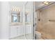 Updated bathroom with shower and double sink vanity at 3047 S Atlantic Ave # 1906, Daytona Beach, FL 32118