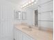 Bathroom with double vanity and large mirror at 3047 S Atlantic Ave # 1906, Daytona Beach, FL 32118