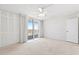 Large bedroom with closet and sliding glass doors to balcony at 3047 S Atlantic Ave # 1906, Daytona Beach, FL 32118
