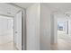 Clean hallway with access to bedrooms and living areas at 3047 S Atlantic Ave # 1906, Daytona Beach, FL 32118