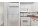 Kitchen with built-in microwave and range at 3047 S Atlantic Ave # 1906, Daytona Beach, FL 32118