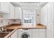 Kitchen with pass-through to dining area and ocean view at 3047 S Atlantic Ave # 1906, Daytona Beach, FL 32118