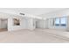 Bright living room with city views and mirrored wall at 3047 S Atlantic Ave # 1906, Daytona Beach, FL 32118