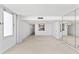 Spacious living room with kitchen pass-through and large window at 3047 S Atlantic Ave # 1906, Daytona Beach, FL 32118
