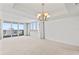 Bright living room featuring large windows with water views at 3047 S Atlantic Ave # 1906, Daytona Beach, FL 32118