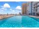 Inviting community pool with ocean views and lounge chairs at 3047 S Atlantic Ave # 1906, Daytona Beach, FL 32118