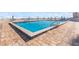 Refreshing community pool with patio and ample seating at 3047 S Atlantic Ave # 1906, Daytona Beach, FL 32118