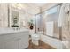 Clean bathroom with a tub, shower, and updated vanity at 310 La Creek Ct, Debary, FL 32713