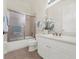 Clean bathroom with a shower/tub combo and white vanity at 310 La Creek Ct, Debary, FL 32713