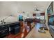 Versatile bonus room with a home office setup and plenty of natural light at 310 La Creek Ct, Debary, FL 32713