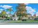 Two-story house with attached garage and palm trees at 310 La Creek Ct, Debary, FL 32713