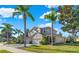 Two-story house with three-car garage and lush landscaping at 310 La Creek Ct, Debary, FL 32713