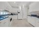 Modern kitchen with white cabinets, blue countertops, and stainless steel appliances at 310 La Creek Ct, Debary, FL 32713